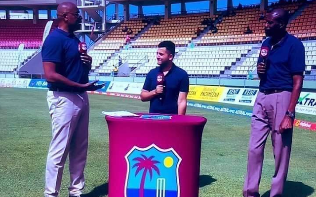 A TV anchor standing between Ian Bishop and Curtly Ambrose (Source - Twitter)