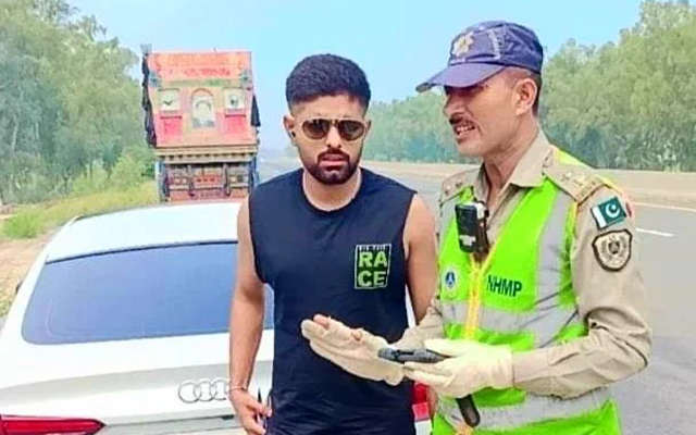 Babar Azam with a traffic police (Source - Twitter)