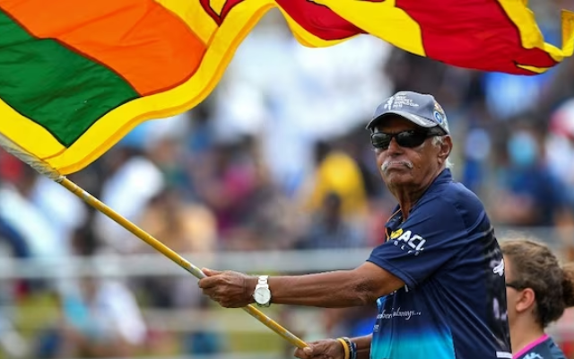 Uncle Percy waving Sri Lankan flag (Source - Twitter)