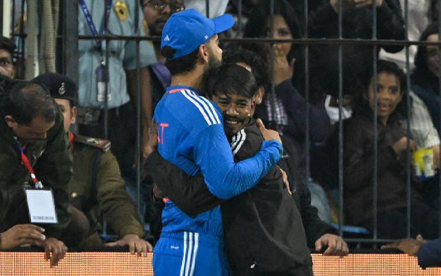 Virat Kohli hugs back his fan